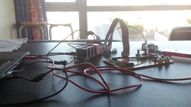 Assorted circuit boards and wires, connected to a laptop off to one side.